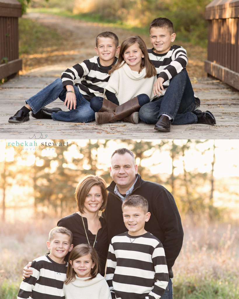 A family smiles at the camera in the fall | child