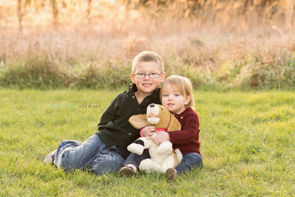 Brother and sister snuggle together | child