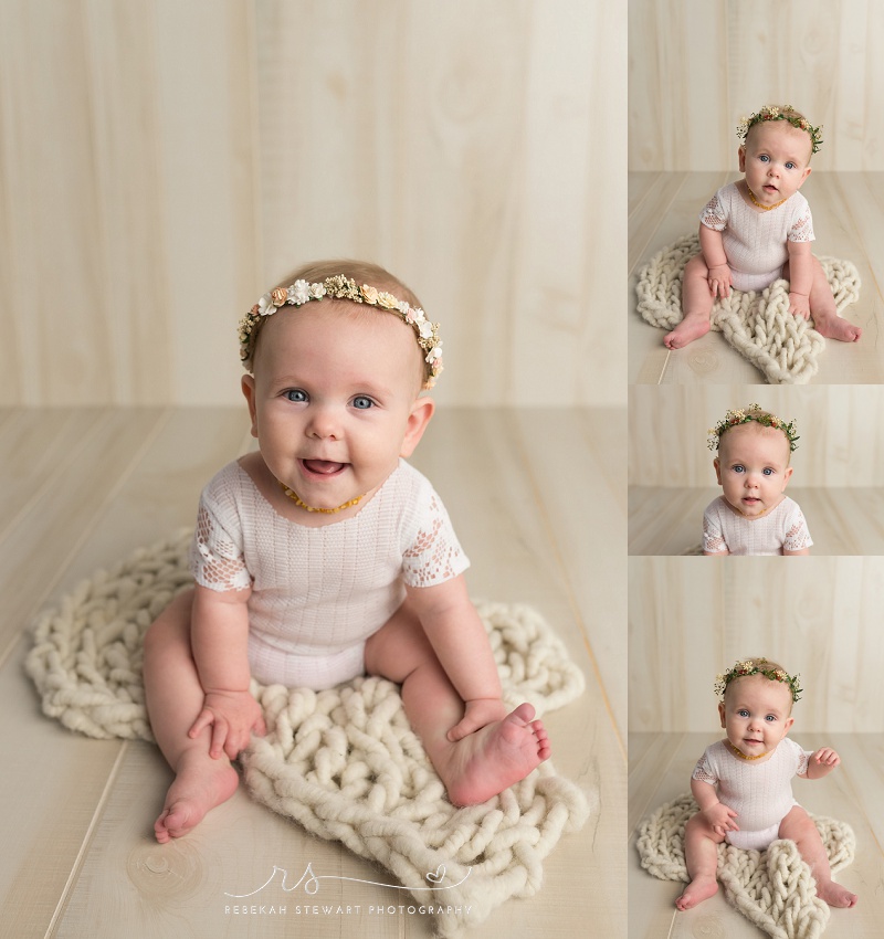 Cedar Rapids baby photography - a one year old baby smiles during her photo session