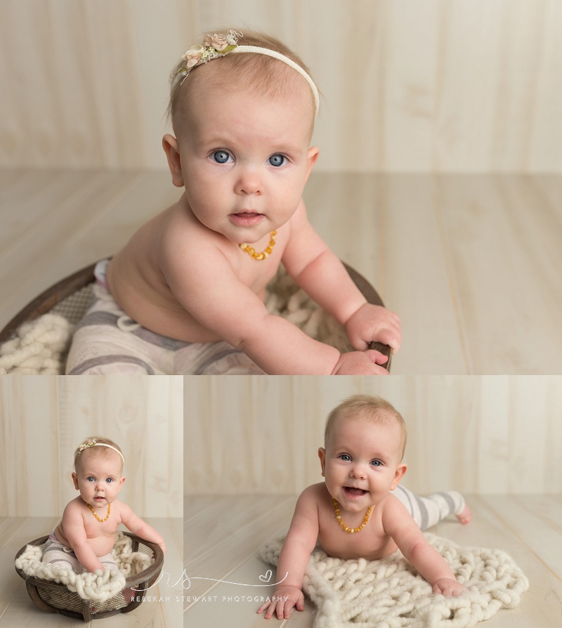 Cedar Rapids baby photography - a one year old baby smiles during her photo session