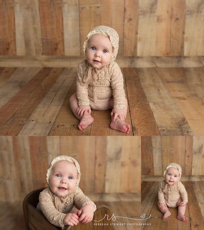 Cedar Rapids baby photography - a one year old baby smiles during her photo session