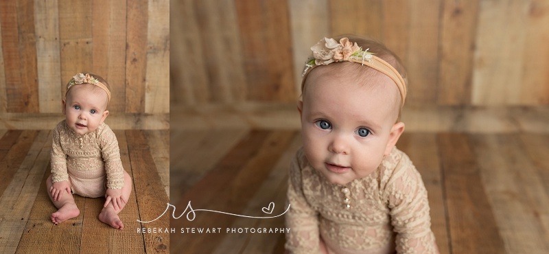 Cedar Rapids baby photography - a one year old baby smiles during her photo session