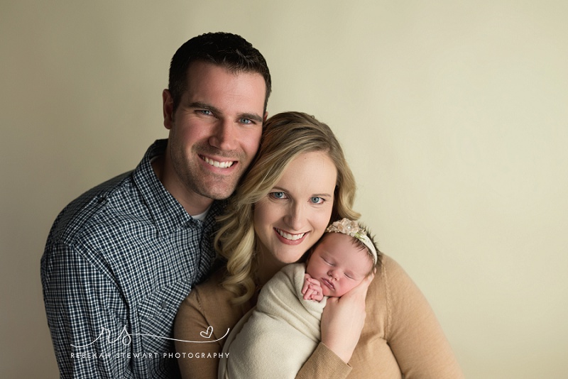 sleepiest baby girl is photographed during her newborn session in Cedar Rapids