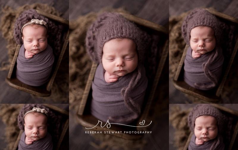 A baby girl is wrapped in purple and naps during her newborn photography session in Cedar Rapids