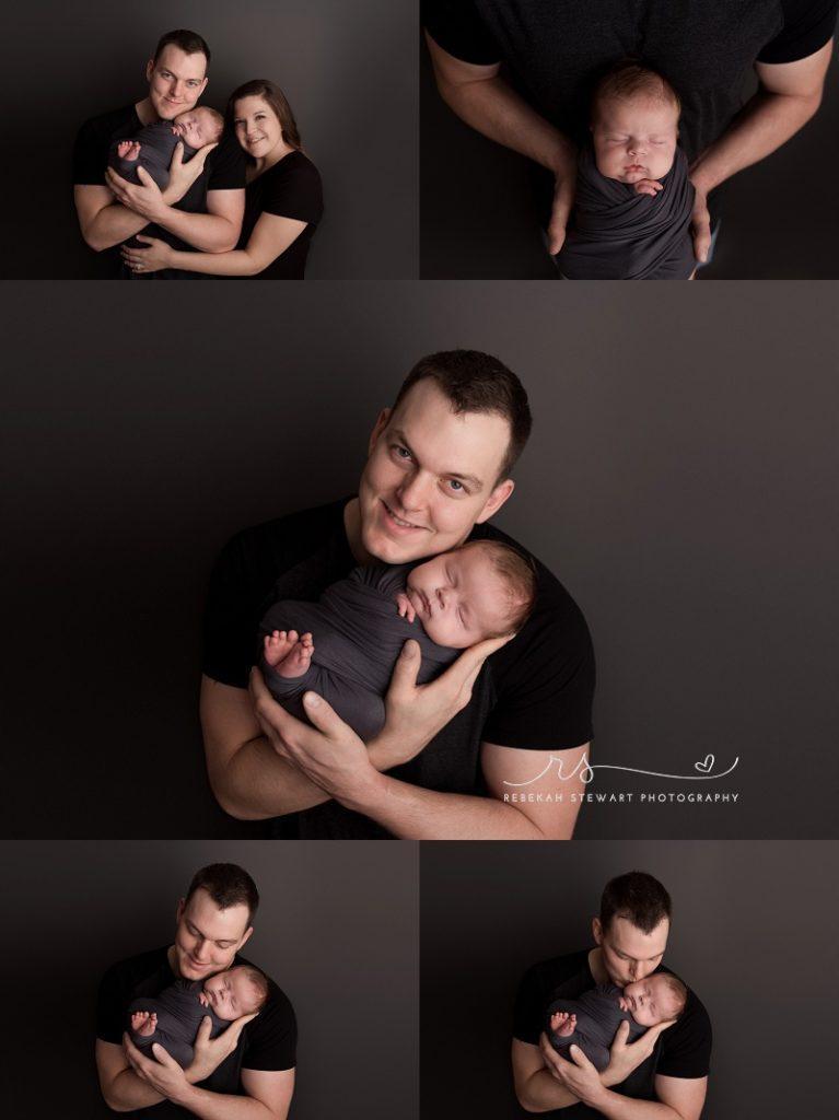 During his session with a Cedar Rapids newborn photographer, a baby boy sleeps in his dad's arms